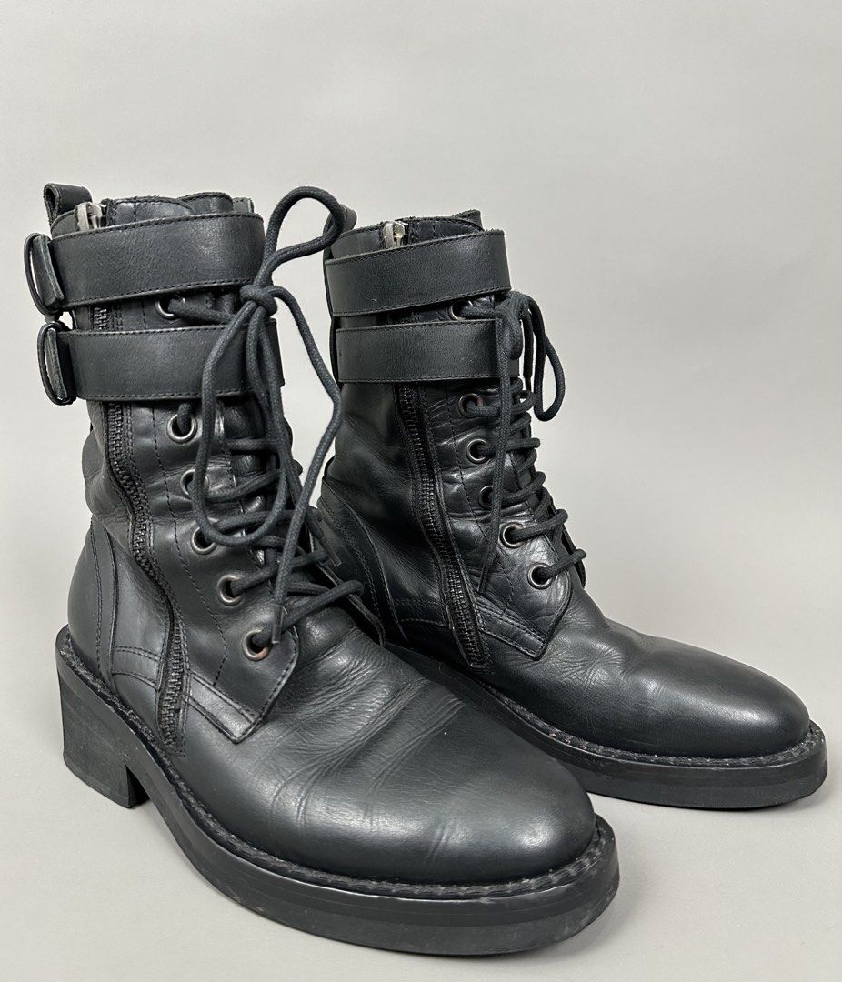 Ann Demeulemeester - Danny Combat Leather Laced-Up Boots. (Category: Boots) located in Manila. Submitted by scissor.2fifthy (Listing ID 1467642051, Image 1). Description: Ann Demeulemeester - Danny Combat Leather Laced-Up Boots. Featured double strap and double side zipper in closure. Tagged size: 35 (see measurement) Made in Italy Material: Leather 85/100 condition rate Used with care Flaw: Minor sign of usage and some scratch Very presentable C