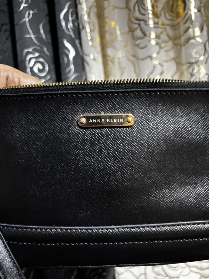 Anne Klein Black Shoulder Bag (Category: Shoulder Bags) located in Cagayan de Oro. Submitted by erica2000 (Listing ID 1467701634, Image 3). Description: - Brand: Anne Klein - Color: Classic Black - Material: Saffiano texture finish with luxurious gold hardware - Closure: Secure top zipper - Pockets: Exterior back zip pocket and interior zip pocket with Anne Klein logo patch - Interior: Fully lined with durable black fabric - Strap: Slim, detachab