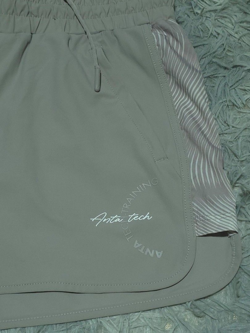 Anta Tech Training Sports Shorts (Category: Shorts) located in Abulug. Submitted by humanwhosellthings (Listing ID 1467734863, Image 2). Description: - Brand:ANTA Womens Drifit Short ✅Excellent Condition ✅Issue: none ▫️Waist Size: 26-32 ▫️Length: 11 - Style: Tech training shorts - Color: Grey - Size: S (fits 160/68A) - Material: Lightweight 78% nylon, 22% spandex blend - Features: Elastic waistband with adjustable drawstring - Storage: Secure zip