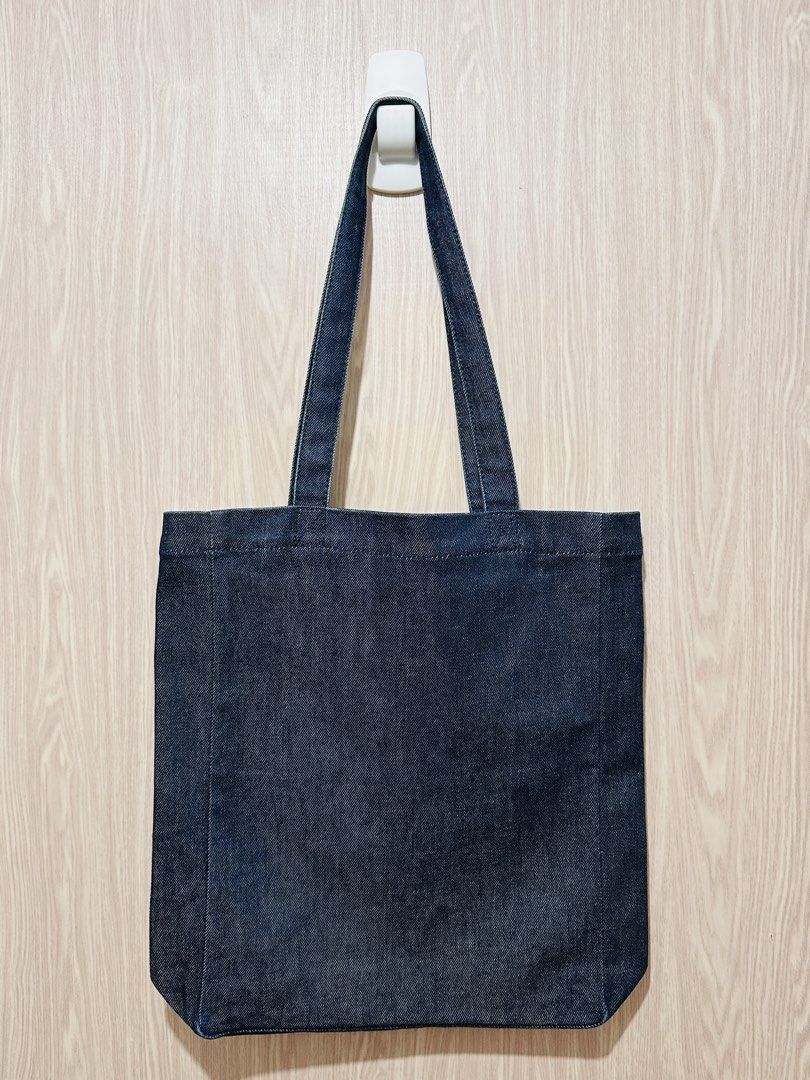 APC Classic Denim Tote Bag with Issue (Category: Tote Bags) located in Quezon City. Submitted by mikemofu (Listing ID 1466962034, Image 2). Description: Authentic APC Denim material Vinyl print logo Unisex Issue: blue stain at the front lower left corner. This is only aesthetic issue, other than that, the bag is 100% functional..