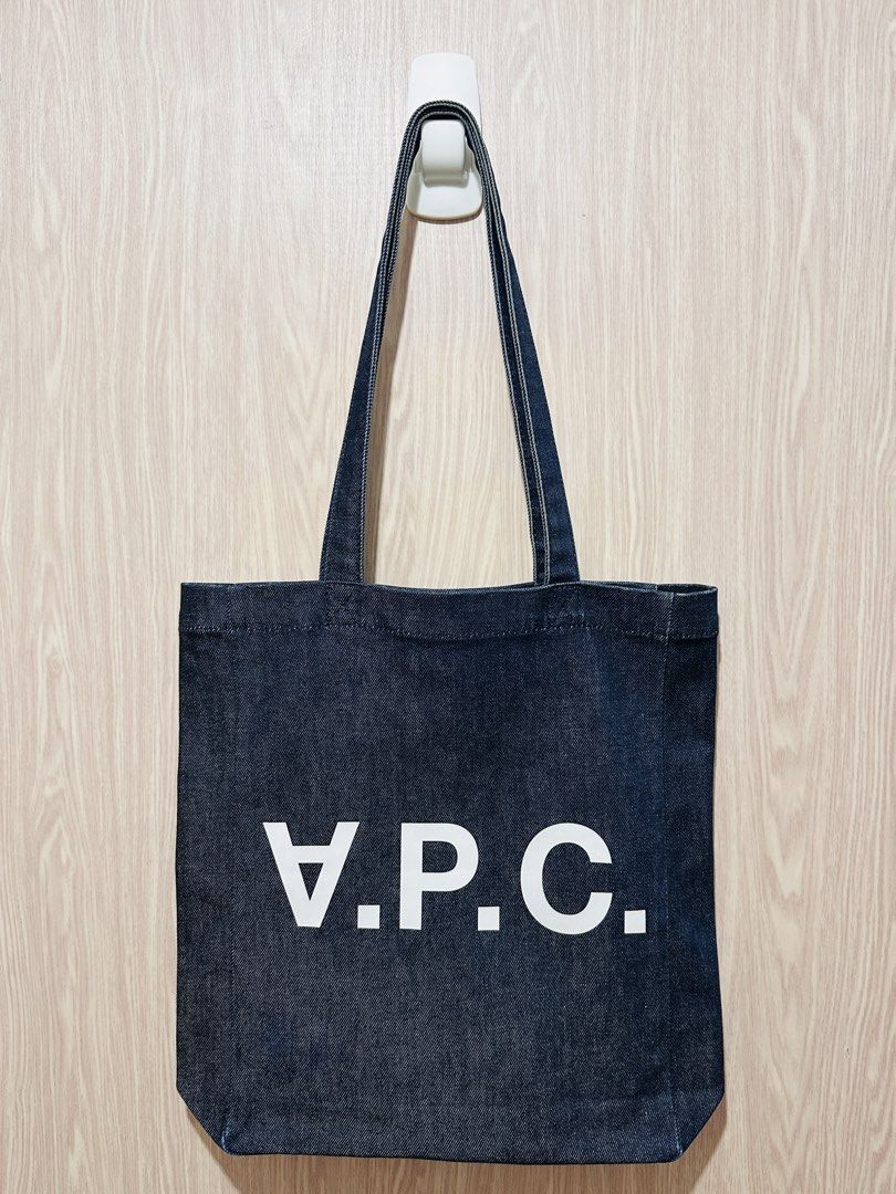 APC Classic Denim Tote Bag with Issue (Category: Tote Bags) located in Quezon City. Submitted by mikemofu (Listing ID 1466962034, Image 1). Description: Authentic APC Denim material Vinyl print logo Unisex Issue: blue stain at the front lower left corner. This is only aesthetic issue, other than that, the bag is 100% functional..