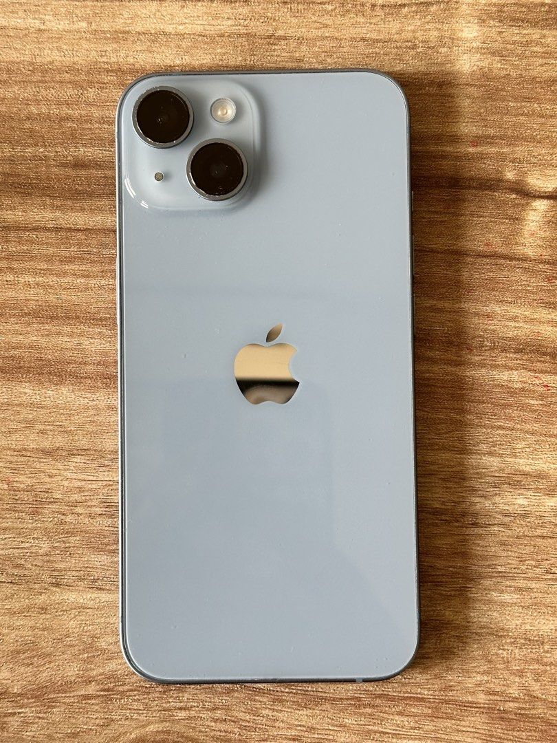 Apple iPhone 14 Blue (Category: iPhone 14 Series) located in Manila. Submitted by ysha.wears (Listing ID 1467623610, Image 2). Description: For sale- Apple iPhone 14 Blue! Purchased on the month of May this year. Still has warranty until April 2027. 89% battery health. 128gb storage. Box included. Original lightning cable included. Honest issue: May chip paint sa paligid ng camera lens. May mga gasgas as seen on the photo. However this does not a