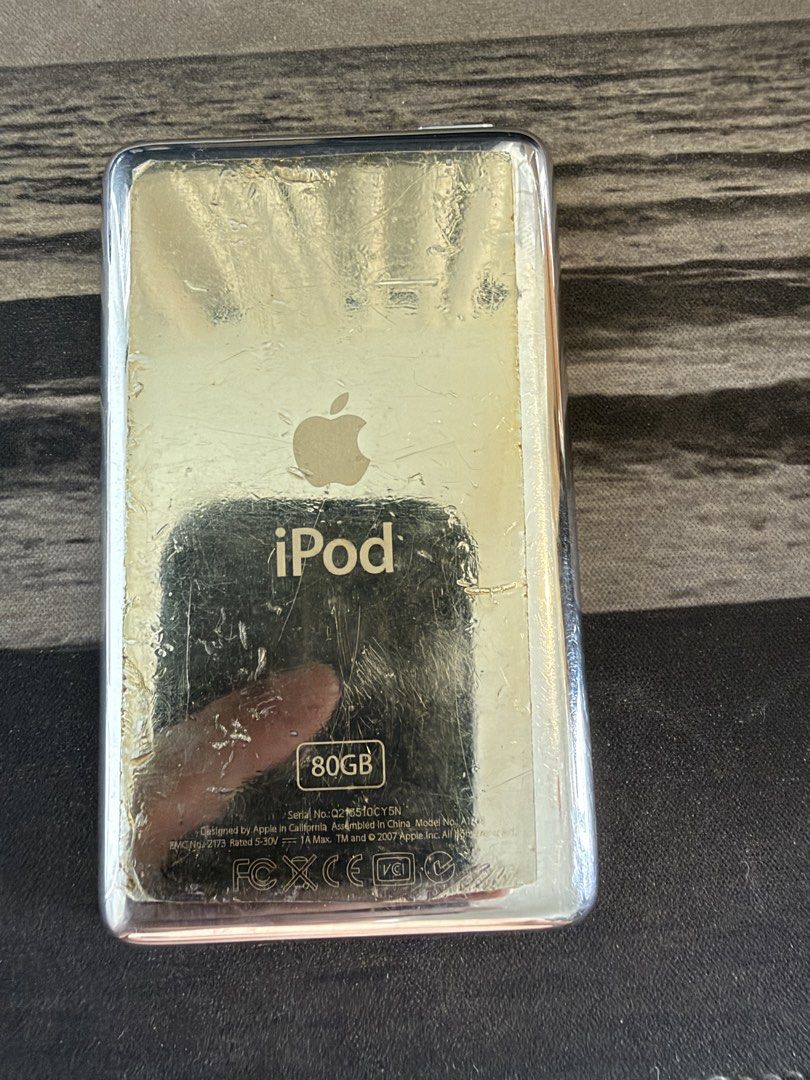 Apple iPod Classic 6th Gen 80GB Silver (Category: Portable Music Players) located in Makati City. Submitted by dennis_dumlao (Listing ID 1467622449, Image 2). Description: - Model: Apple iPod Classic 80GB - Color: Silver - Serial Number: Q216510CY5N - Features: Iconic click wheel, 30-pin dock connector, top headphone jack, and hold switch - Condition: Heavy cosmetic wear including deep scratches on the front screen and silver back casing - Detail