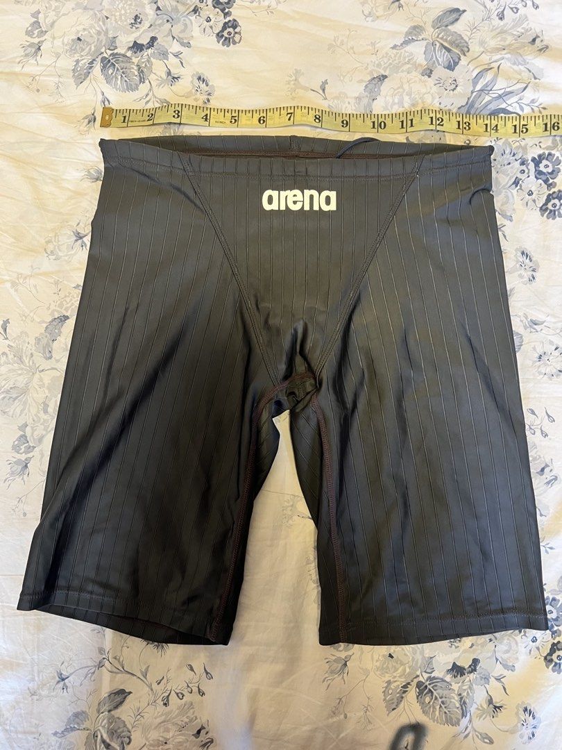 Arena Swim Jammers (Category: Swim Trunks & Board Shorts) located in Tabaco. Submitted by edmarbron (Listing ID 1467800363, Image 1). Description: - Brand: Arena - Color: Dark grey with vertical stripes - Logo: White Arena logo on the front waistband - Fit: Adjustable inner drawstring waist (14cm laid flat ) - Condition: Worn condition with some wear on the inner hologram authenticity tag - Features: High-performance tech suit designed for compet
