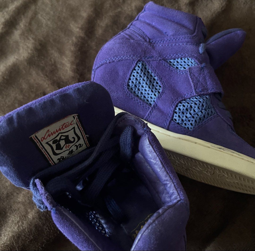 ASH Purple Wedge High Top Sneaker (Category: Sneakers) located in Manila. Submitted by home.less.guy (Listing ID 1467624879, Image 2). Description: - Brand: ASH - Size: EU 36 to 37 - Style: High-top hidden wedge sneakers - Material: Premium purple suede and blue mesh panels - Closure: Laces with a secure velcro strap - Sole: White rubber outsole with great tread.
