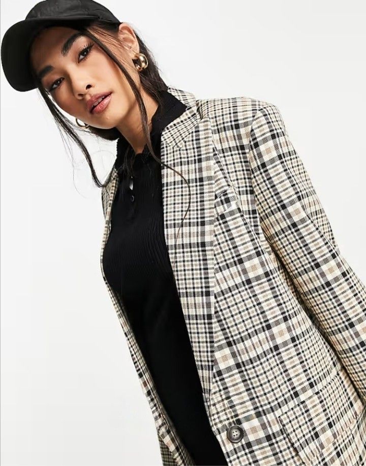 ASOS DESIGN Longline Perfect Blazer in Multi Check (Category: Coats, Jackets and Outerwear) located in Cabanatuan. Submitted by miss.maia (Listing ID 1467763814, Image 1). Description: ASOS DESIGN Longline Perfect Blazer in Multi Check. It features a classic relaxed longline silhouette, padded shoulders, notch lapels, a single-button closure, and front pockets decorated in a cream, khaki green, and dark brown vintage-style plaid pattern.