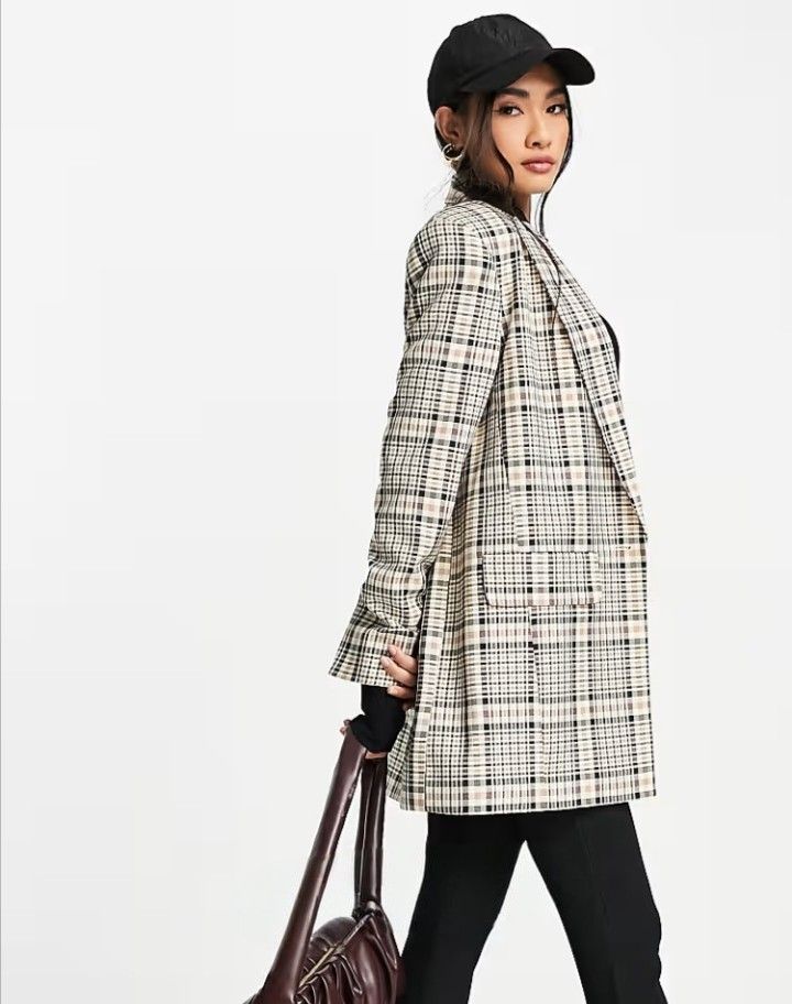 ASOS DESIGN Longline Perfect Blazer in Multi Check (Category: Coats, Jackets and Outerwear) located in Cabanatuan. Submitted by miss.maia (Listing ID 1467763814, Image 3). Description: ASOS DESIGN Longline Perfect Blazer in Multi Check. It features a classic relaxed longline silhouette, padded shoulders, notch lapels, a single-button closure, and front pockets decorated in a cream, khaki green, and dark brown vintage-style plaid pattern.
