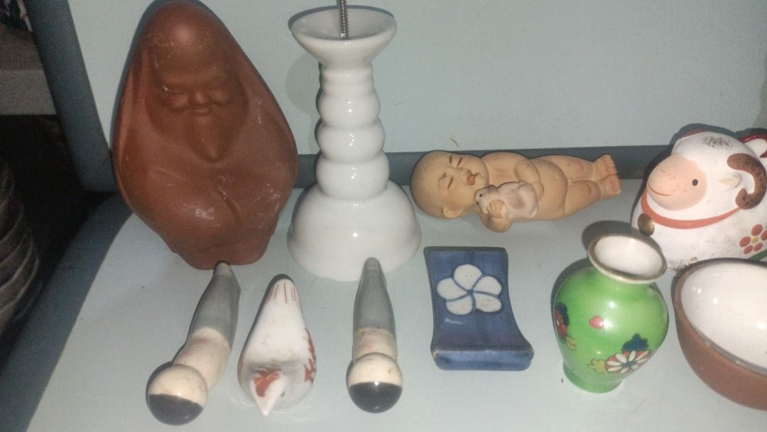Assorted Japanese Ceramic Ornaments Figures and Tea Set (Category: Vintage Collectibles) located in Munoz. Submitted by larryc1212 (Listing ID 1467681783, Image 2). Description: - Diverse collection of Asian decorative pieces - Includes ceramic guardian lion, sheep, miniature tea cups, and small vases - Features chopstick rests, a wooden Japanese calligraphy plaque, and a retro boxed doll - Made from quality pottery, porcelain, and wood - Perfect