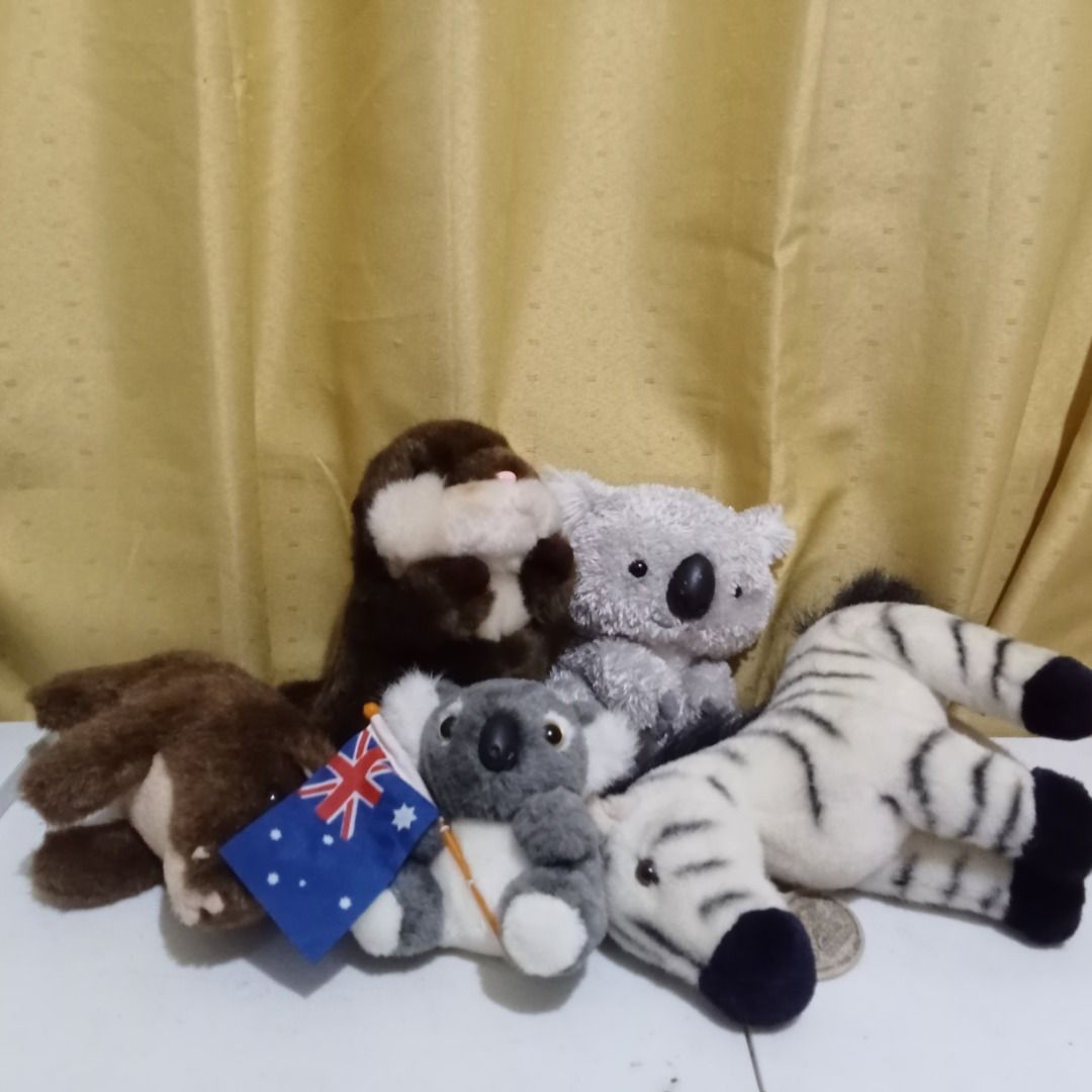 Assorted Plush Toys Animal Bundle Koala Zebra Otter (Category: Plushies & Soft Toys) located in Quezon City. Submitted by trinket_cat (Listing ID 1467679220, Image 1). Description: - Set of 5 soft stuffed animals: zebra, brown otter, light grey koala, dark grey koala with Australian flag, and brown plush - Great addition for kids or plush toy collectors - Ready for gifting or display.
