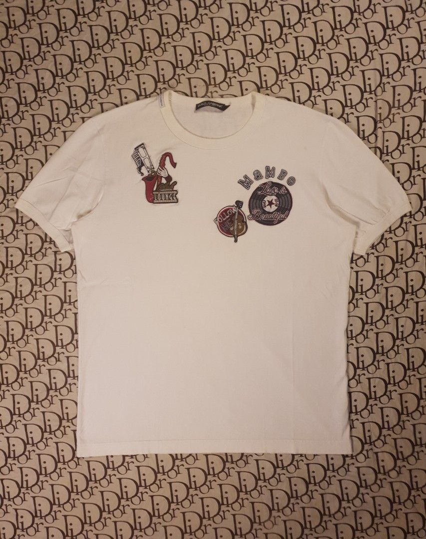 Authentic Dolce and Gabanna shirt (Category: Shirts) located in San Fernando. Submitted by retro.district. (Listing ID 1467820357, Image 1). Description: - Authentic D&G patchwork tshirt - Size: Large - Condition: Excellent - No issue.