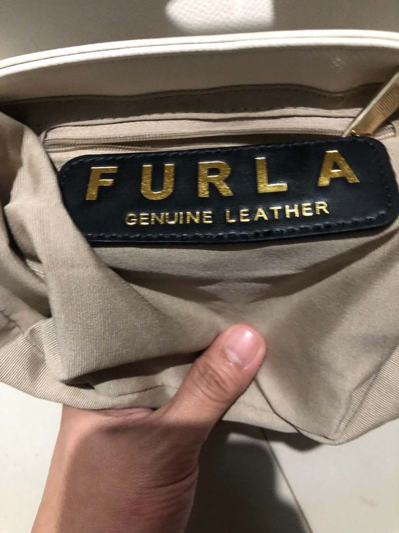 Authentic furla (Category: Cross-body Bags) located in Consolacion. Submitted by kulotfatty (Listing ID 1467626115, Image 3). Description: cream color sa body brown inside.
