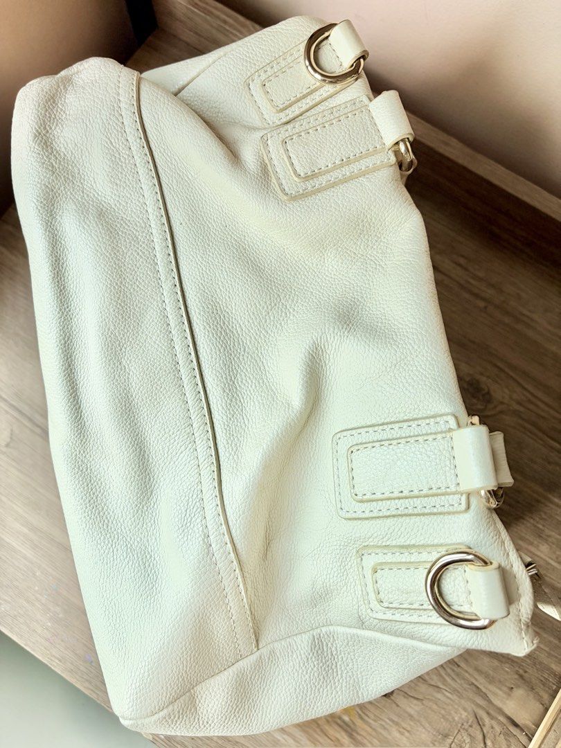 Authentic Givenchy Pandora (Category: Luxury Bags & Wallets) located in Manila. Submitted by ladybagmnl (Listing ID 1467607312, Image 2). Description: Super nice slouchy shape and the leather is still buttery soft. Price:₱8500 plus sf(slightly negotiable) Color: Off-white/Cream Size: Medium (12.6" x 7" approx.) Condition: Very Good pre-loved condition, clean lining inside, hardware is still good. Flaw:missing strap, hence selling low Please manag