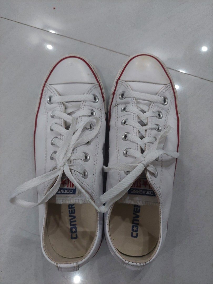 Authentic Leather Converse Chuck Taylor (Category: Dress Shoes) located in Calamba. Submitted by carbon.142 (Listing ID 1467777441, Image 1). Description: Color: White w/ Red & Blue trim Material: White Leather Upper / Rubber Sole Condition: lightly used Price: 700 (Negotiable) 100% Authentic! -light stain on toe cap.