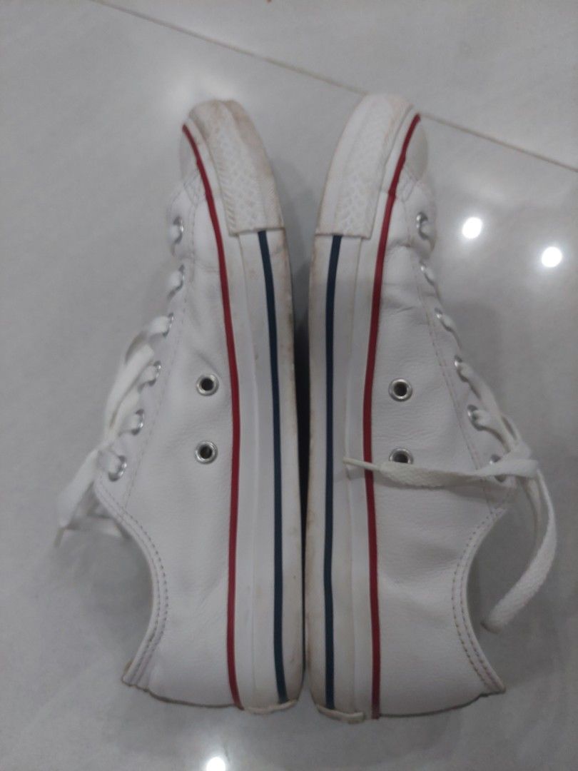 Authentic Leather Converse Chuck Taylor (Category: Dress Shoes) located in Calamba. Submitted by carbon.142 (Listing ID 1467777441, Image 2). Description: Color: White w/ Red & Blue trim Material: White Leather Upper / Rubber Sole Condition: lightly used Price: 700 (Negotiable) 100% Authentic! -light stain on toe cap.