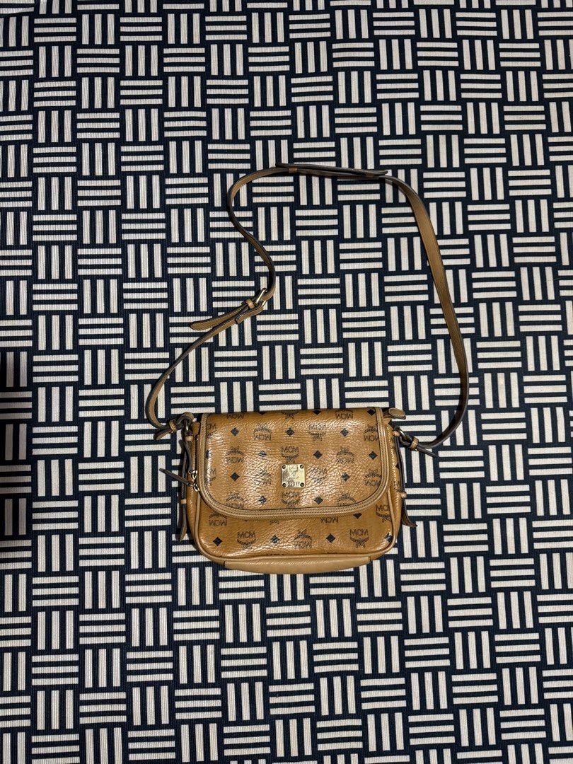 Authentic MCM Monogram Leather Crossbody Bag (Category: Luxury Bags & Wallets) located in Manila. Submitted by garcianath68674 (Listing ID 1467731073, Image 1). Description: - Authentic MCM crossbody bag in classic brown Visetos monogram print - Secure flap front design with gold-tone hardware plate and engraved serial number (G2015) - Main zip closure hidden underneath the flap for extra security - Adjustable leather shoulder strap complete with