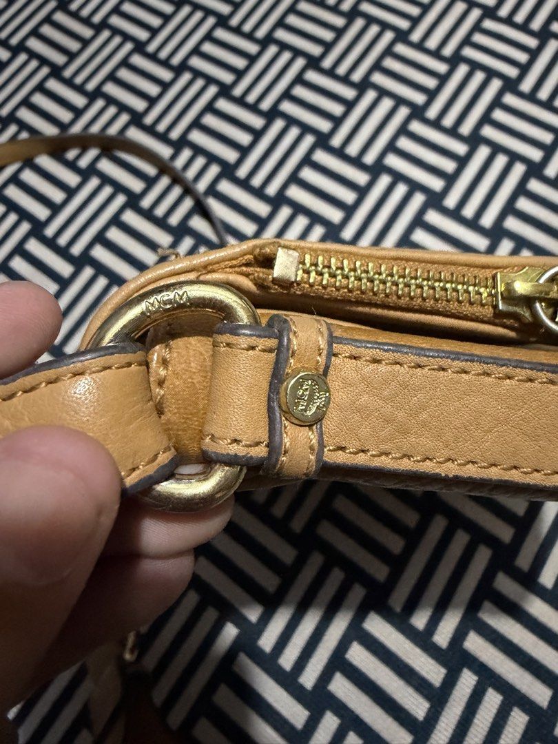 Authentic MCM Monogram Leather Crossbody Bag (Category: Luxury Bags & Wallets) located in Manila. Submitted by garcianath68674 (Listing ID 1467731073, Image 3). Description: - Authentic MCM crossbody bag in classic brown Visetos monogram print - Secure flap front design with gold-tone hardware plate and engraved serial number (G2015) - Main zip closure hidden underneath the flap for extra security - Adjustable leather shoulder strap complete with