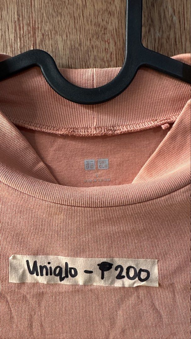 Authentic Uniqlo Ribbed Blouse Salmon Small (Category: Blouses) located in Cavite. Submitted by __elizagarcia.xi (Listing ID 1467777788, Image 2). Description: - Brand: Uniqlo (100% Authentic) - Color: Salmon Pink - Size: Small - Style: Short sleeves with mock neck - Condition: Excellent / Like new - Original Price: ₱790 - Perfect everyday top, easy to pair with jeans or skirts.