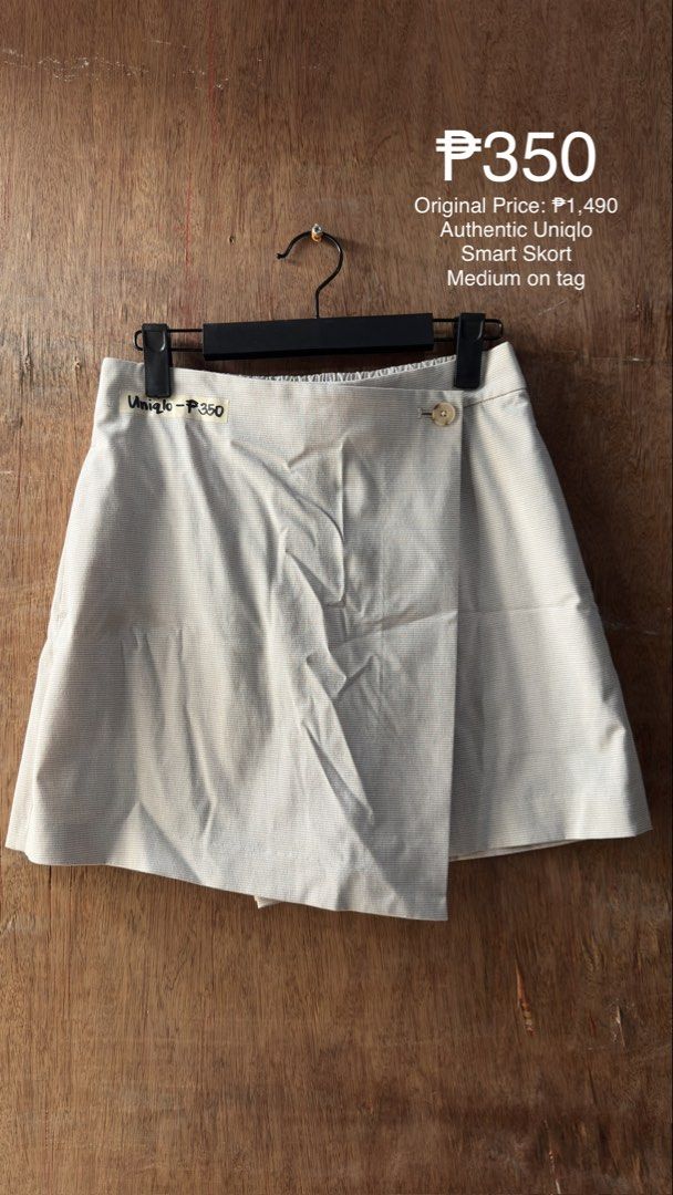 Authentic Uniqlo Smart Skort Medium (Category: Skirts) located in Cavite. Submitted by __elizagarcia.xi (Listing ID 1467775489, Image 1). Description: - Brand: Authentic Uniqlo - Item: Smart Skort - Size: Medium (Waist: 63-69 cm | Hips: 88-94 cm) - Material: 66% Polyester, 32% Rayon, 2% Spandex - Design: Neutral plaid pattern with wrap front and single button closure - Original Retail Price: ₱1,490 - Condition: Excellent / Like new.
