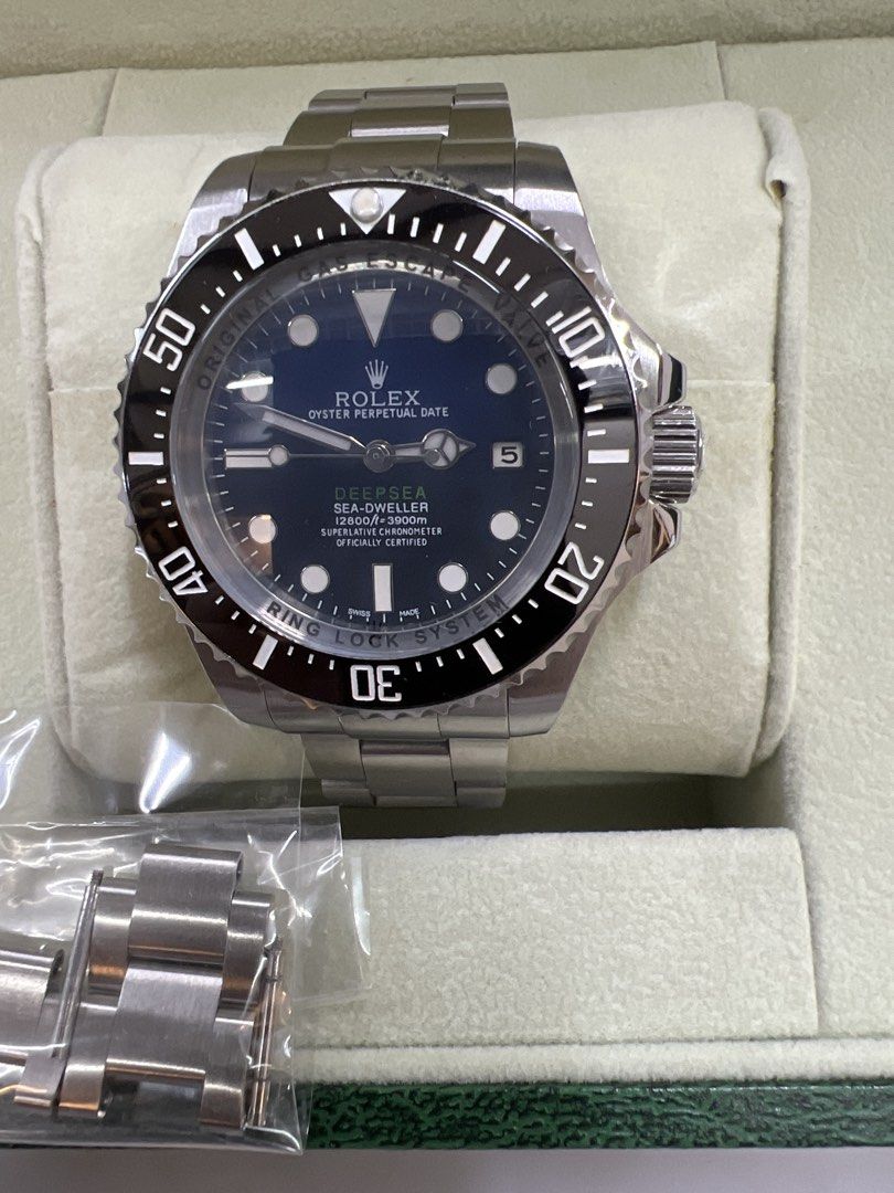 Automatic Watch (Category: Watches) located in Singapore. Submitted by jadedeemperor (Listing ID 1467656138, Image 1). Description: - Model: Rolex Sea-Dweller Deepsea Professional Diving Watch - Dial: Black with high-visibility white markers and date window at 3 o'clock - Bezel: Rotating black ceramic bezel - Case & Bracelet: Stainless steel Oyster bracelet with heavy-duty titanium caseback and Ring Lock System rehaut engraving - Inclusions: Orig