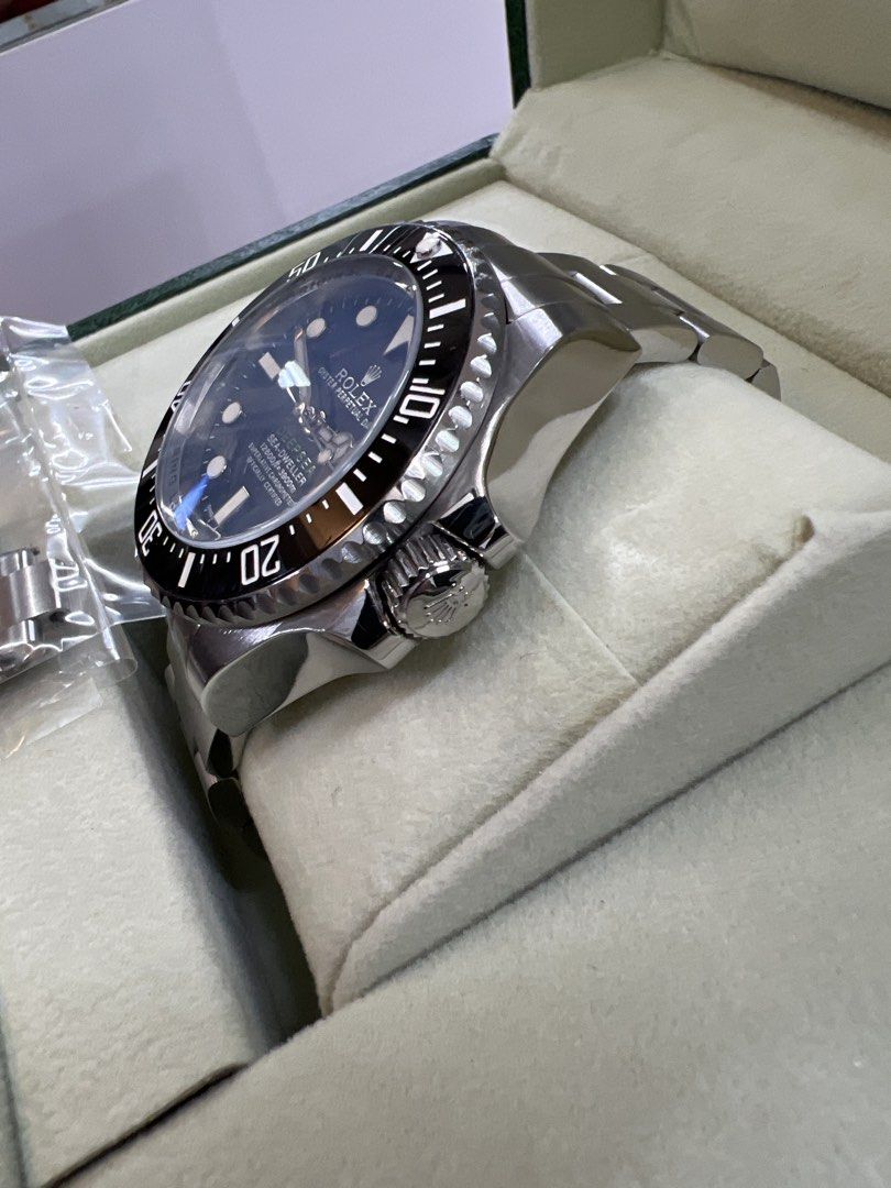 Automatic Watch (Category: Watches) located in Singapore. Submitted by jadedeemperor (Listing ID 1467656138, Image 2). Description: - Model: Rolex Sea-Dweller Deepsea Professional Diving Watch - Dial: Black with high-visibility white markers and date window at 3 o'clock - Bezel: Rotating black ceramic bezel - Case & Bracelet: Stainless steel Oyster bracelet with heavy-duty titanium caseback and Ring Lock System rehaut engraving - Inclusions: Orig