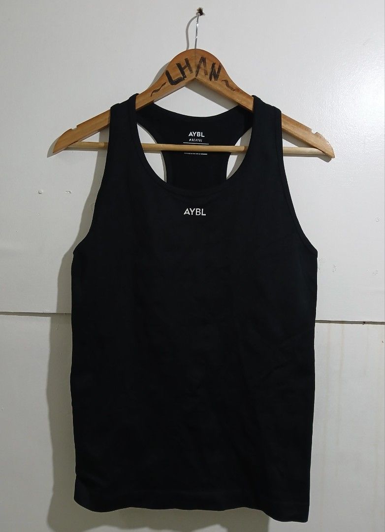 AYBL Black Run Ruched Tank Top Size L (Category: Sleeveless) located in Taguig. Submitted by thriftnilhan (Listing ID 1467719495, Image 1). Description: - Brand: AYBL - Style: Run ruched tank top with racerback - Color: Black - Size: Large - Details: Small branding on front chest and back neck - Origin: Designed in the UK - Condition/Use: Comfortable activewear, ideal for workouts or casual daily wear.