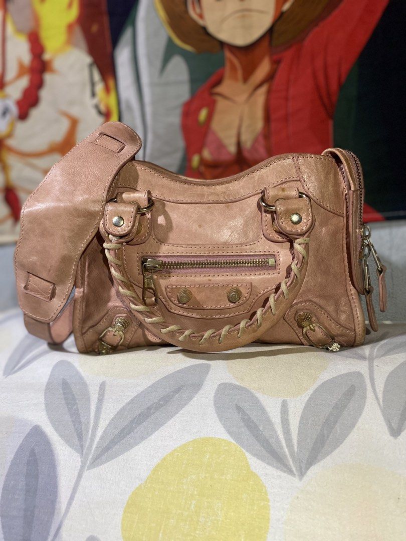 Balenciaga mini city (Category: Luxury Bags & Wallets) located in San Fernando. Submitted by twinkz_tree (Listing ID 1467620600, Image 1). Description: Balenciaga mini city slingbag Pre loved balenciaga All details posted Lampo zip Sign of used 8/10color rate Leather cleaning.