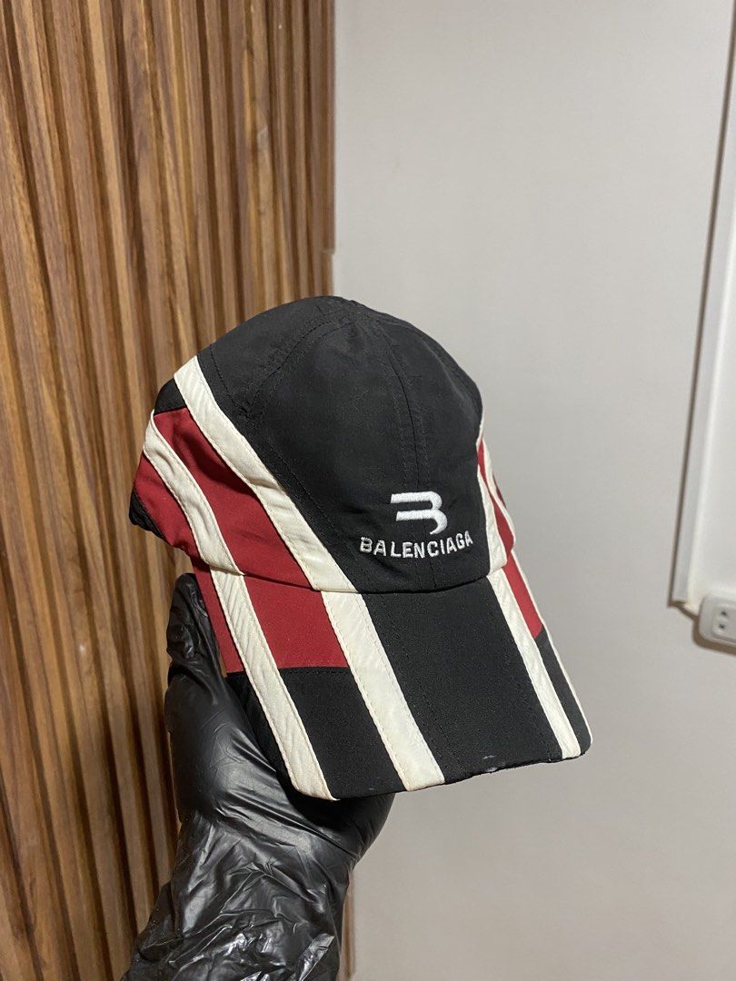 Balenciaga Multi-Panel Baseball Cap (Category: Caps & Hats) located in Caloocan City. Submitted by heatedcaps4425 (Listing ID 1467799714, Image 2). Description: - Brand: Balenciaga - Design: Black, red, and white colorblock with embroidered front logo - Material: Lightweight nylon with inner fabric care labels - Fit: Adjustable Velcro strap at the back with woven brand tag inside - Shape: Clean structure with a curved brim - Condition: Brand new 