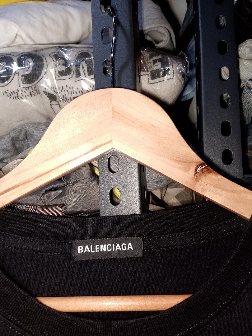 Balenciaga Rainbow Laurel Tee Black Size L (Category: Activewear) located in Manila. Submitted by mjthrifted_second (Listing ID 1467640086, Image 2). Description: - Authentic Balenciaga black t-shirt - Size: Large (tag attached to inner collar) -Dimes: 25/30 - Features a colorful rainbow embroidered laurel wreath logo across the chest - Crafted in Portugal - Classic relaxed fit for a stylish streetwear look - Condition: Excellent.