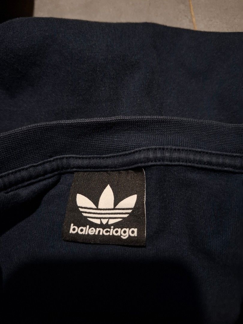 Balenciaga x Adidas (Category: Tshirts & Polo Shirts ) located in Rizal. Submitted by marcothrifts (Listing ID 1467716583, Image 3). Description: Balenciaga x Adidas Embroidered Logo Width: 21 Length: 28 Color rate: 9.8/10 Verygood Condition No issue.