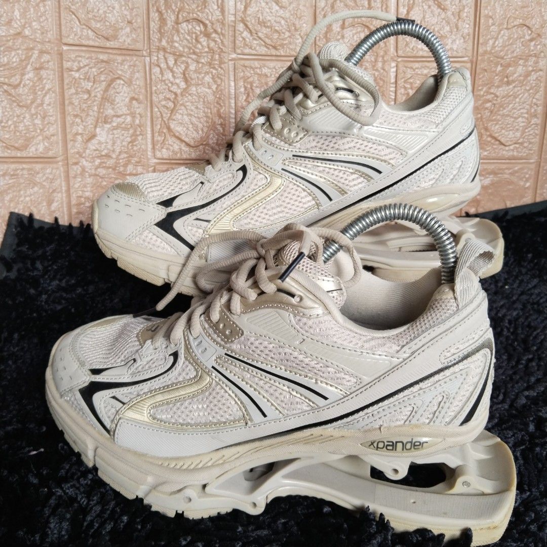 Balenciaga Xpander Chunky Sneaker Neutral Cream (Category: Sneakers) located in Lubao. Submitted by dione_closet503 (Listing ID 1467613279, Image 1). Description: - Style: Trendy chunky sneakers in a neutral cream tone with chic metallic gold and black panel details - Design: Distinctive cut-out heel architecture with breathable mesh uppers and lace-up closure - Comfort & Durability: Thick athletic soles with solid grip and sturdy construction fo
