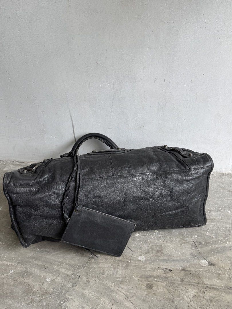 Balenciga city part time (Category: Luxury Bags & Wallets) located in Quezon City. Submitted by streetgallerygarments (Listing ID 1467631660, Image 3). Description: Gray lambskin leather Balenciaga Classic City or Part-Time two-way motorcycle bag Made in:Italy Color- Gray Condition:9/10 Material:Leather Issue:scratch,stain zipper Shipping courier Local Jnt/LBC/Lalamove international DHL express .