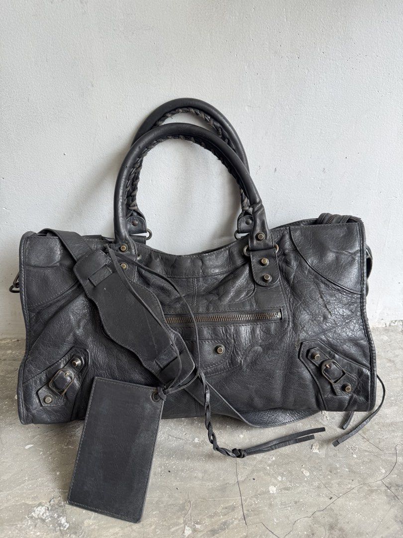 Balenciga city part time (Category: Luxury Bags & Wallets) located in Quezon City. Submitted by streetgallerygarments (Listing ID 1467631660, Image 1). Description: Gray lambskin leather Balenciaga Classic City or Part-Time two-way motorcycle bag Made in:Italy Color- Gray Condition:9/10 Material:Leather Issue:scratch,stain zipper Shipping courier Local Jnt/LBC/Lalamove international DHL express .