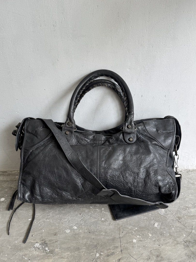 Balenciga city part time (Category: Luxury Bags & Wallets) located in Quezon City. Submitted by streetgallerygarments (Listing ID 1467631660, Image 2). Description: Gray lambskin leather Balenciaga Classic City or Part-Time two-way motorcycle bag Made in:Italy Color- Gray Condition:9/10 Material:Leather Issue:scratch,stain zipper Shipping courier Local Jnt/LBC/Lalamove international DHL express .