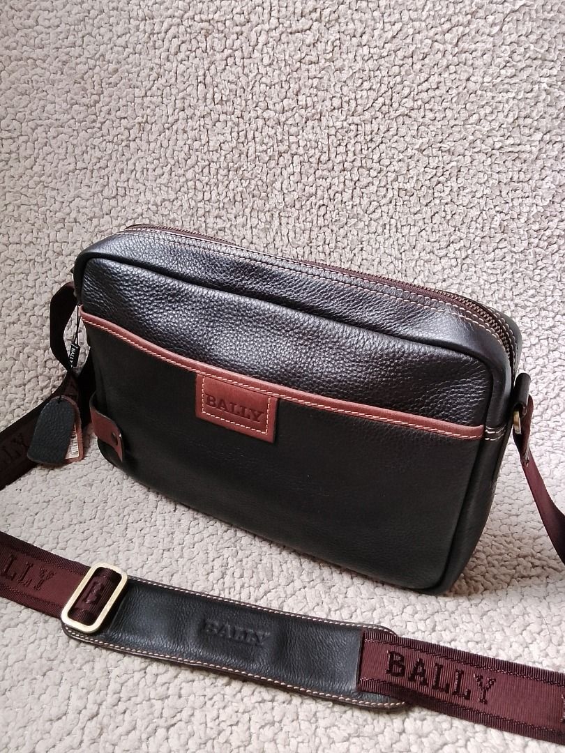 Bally Brown Leather Crossbody Bag (Category: Luxury Bags & Wallets) located in Las Pinas. Submitted by flyhigh23 (Listing ID 1467683949, Image 1). Description: - Brand: Bally - Material: Rich brown pebbled leather with contrasting lighter brown trim - Condition: Brand new with tag attached - Strap: Adjustable fabric strap with comfortable leather shoulder pad - Pockets: Front exterior magnetic pocket, interior zip pocket, and slip pockets - Closu