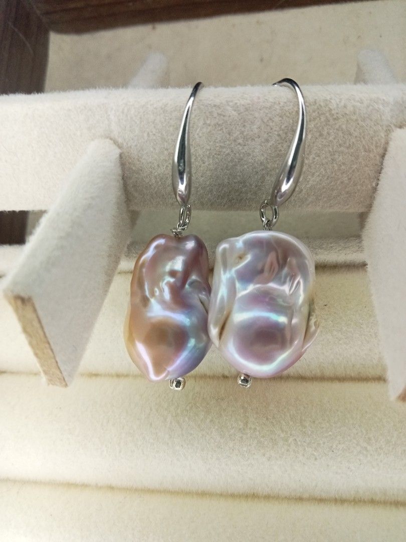 Baroque Pearl Drop Earrings with Silvertone Hooks (Category: Earrings) located in Davao. Submitted by kimpoycaye62726 (Listing ID 1467637903, Image 3). Description: - 13mmx20mm Stunning drop earrings baroque pearls - Beautiful iridescent pink and purple tones with strong orient and lustre - Unique potato-shaped pearls featuring natural surface irregularities and a high-shine finish - Silver-toned metal hook-style closures - Dangles gracefully whe