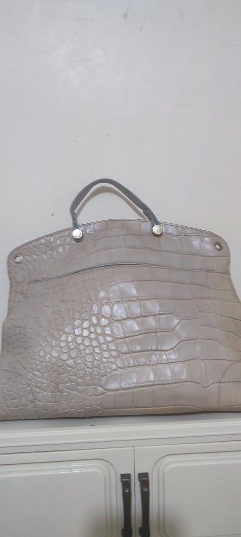 Furla Croc Embossed Leather Handbag with Strap (Category: Luxury Bags & Wallets) located in Caloocan City. Submitted by guiltypleasures75 (Listing ID 1467818149, Image 2). Description: with embossed crocodile pattern - Style: Structured handbag with top handle and matching shoulder strap - Details: Front flap, small padlock accent, zipper detail, and silver-tone hardware - Interior: Roomy and practical for everyday use - Condition: normal sign of