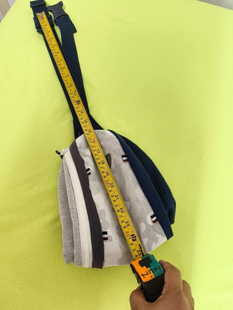 Beltbag with Adjustable Strap (Category: Announcements) located in Angeles City. Submitted by MTstuffs (Listing ID 1467633565, Image 2). Description: White camo Belt bag , ykk zip...measuring 25 inches long with dark blue trim kasya 50 inch waistline, adjustable strap, and a dual-zipper main closure. The interior features grey lining, multiple slip pockets, and a zippered pocket. Stylish, spacious, and great for daily use. Washable 😊.