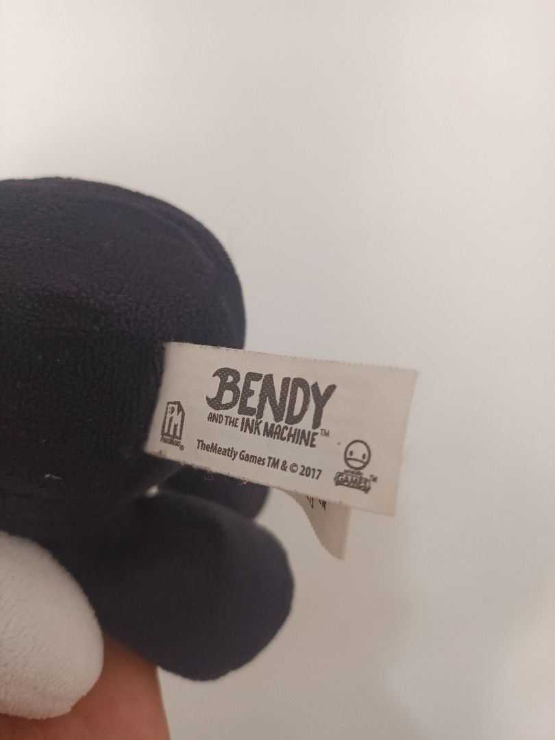 Bendy and the Ink Machine Bendy Plush (Category: Plushies & Soft Toys) located in Jaen. Submitted by safecloud_c5fdf1 (Listing ID 1467653986, Image 2). Description: - Official Bendy and the Ink Machine merchandise from 2017 (TheMeatly Games) - Classic black and white character design featuring signature horns and wide grin - Made with soft fabric, clean and well-maintained condition - Comes with original tag attached - Standard small collectible 