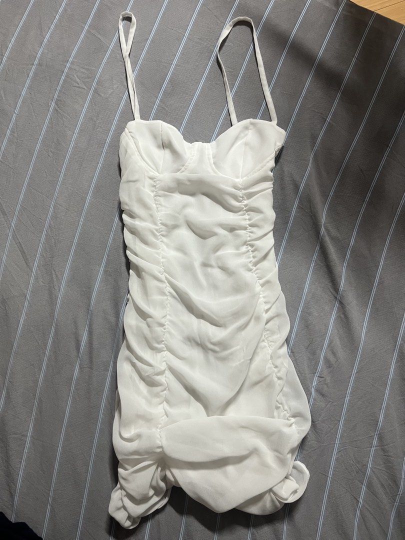 BERSHKA white fitted ruffle mini dress (Category: Dresses) located in Manila. Submitted by jcdrpsta (Listing ID 1467773142, Image 1). Description: XS (stays true to its size) well used! (check photos for flaws) - not that visible (flaws) but i suggest to re-stitch a little the chest part :) cute dress for parties or dinners:) mop: gcash/bpi loc: taft, manila / taytay, rizal .