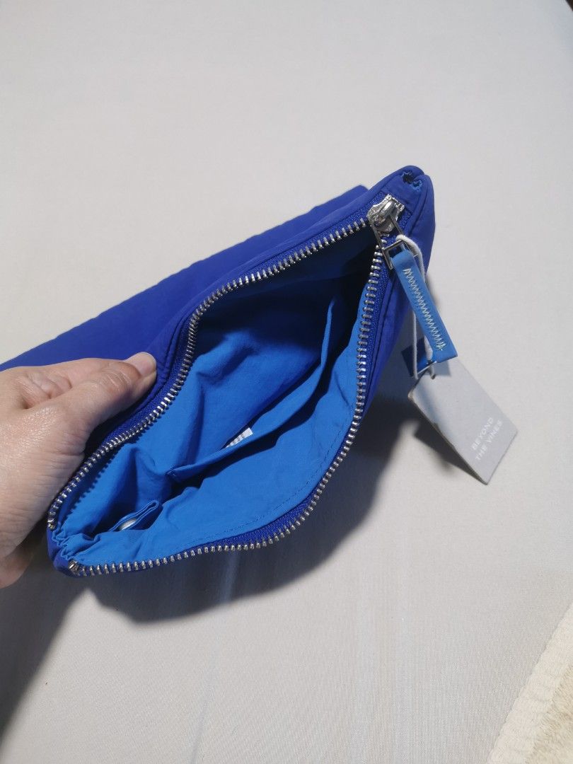 Beyond The Vines Poofy Pouch Blue (Category: Purses & Pouches) located in Makati City. Submitted by denvergirl1119 (Listing ID 1467834194, Image 2). Description: - Authentic Beyond The Vines Poofy Pouch in Blue - Brand new, pristine condition with original tags attached - Comes with the official Beyond The Vines paper bag - Trendy quilted puffer exterior with a secure zipper closure - Blue interior lining featuring a convenient inner pocket - Per