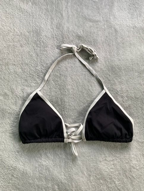 Black and white halter bikini top (Category: Bikinis & Swimsuits) located in Rizal. Submitted by sheeraay (Listing ID 1467647885, Image 2). Description: - Style: Black triangle bikini top with contrast white piping.