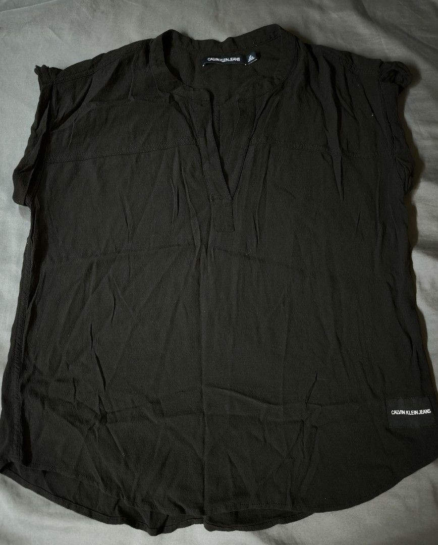 Black Calvin Klein plain blouse (Category: Blouses) located in Manila. Submitted by wearforce (Listing ID 1467763704, Image 1). Description: Black Calvin Klein plain blouse fit: M-L good condition color rate 10/10 350 + sf.