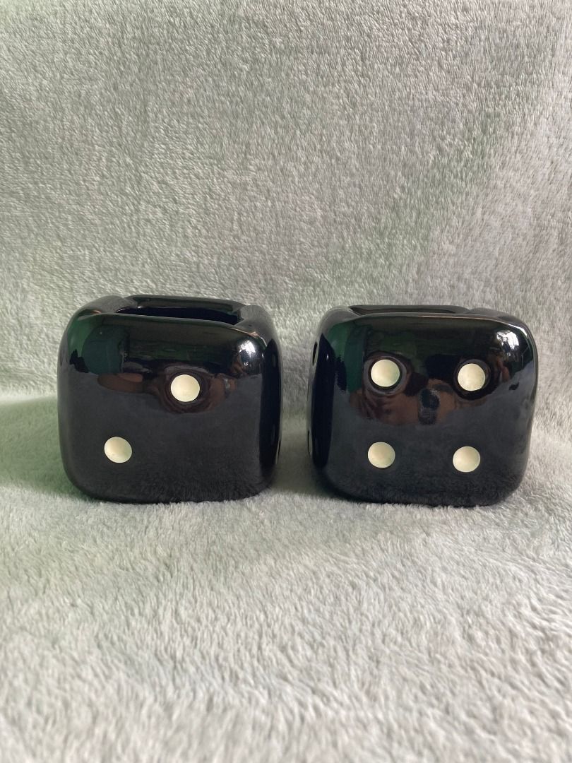 Black Ceramic Dice Ashtray / Accent Display Ornament (Category: Vintage Collectibles) located in Rizal. Submitted by sheeraay (Listing ID 1467707632, Image 2). Description: - Set of two black ceramic dice ashtrays - Features white dots and a sleek glossy finish - Heavy, solid build with unique indented tops - Condition: Minimal wear - Perfect decor for game rooms, man caves, or smoking lounges -Can be accent decor.