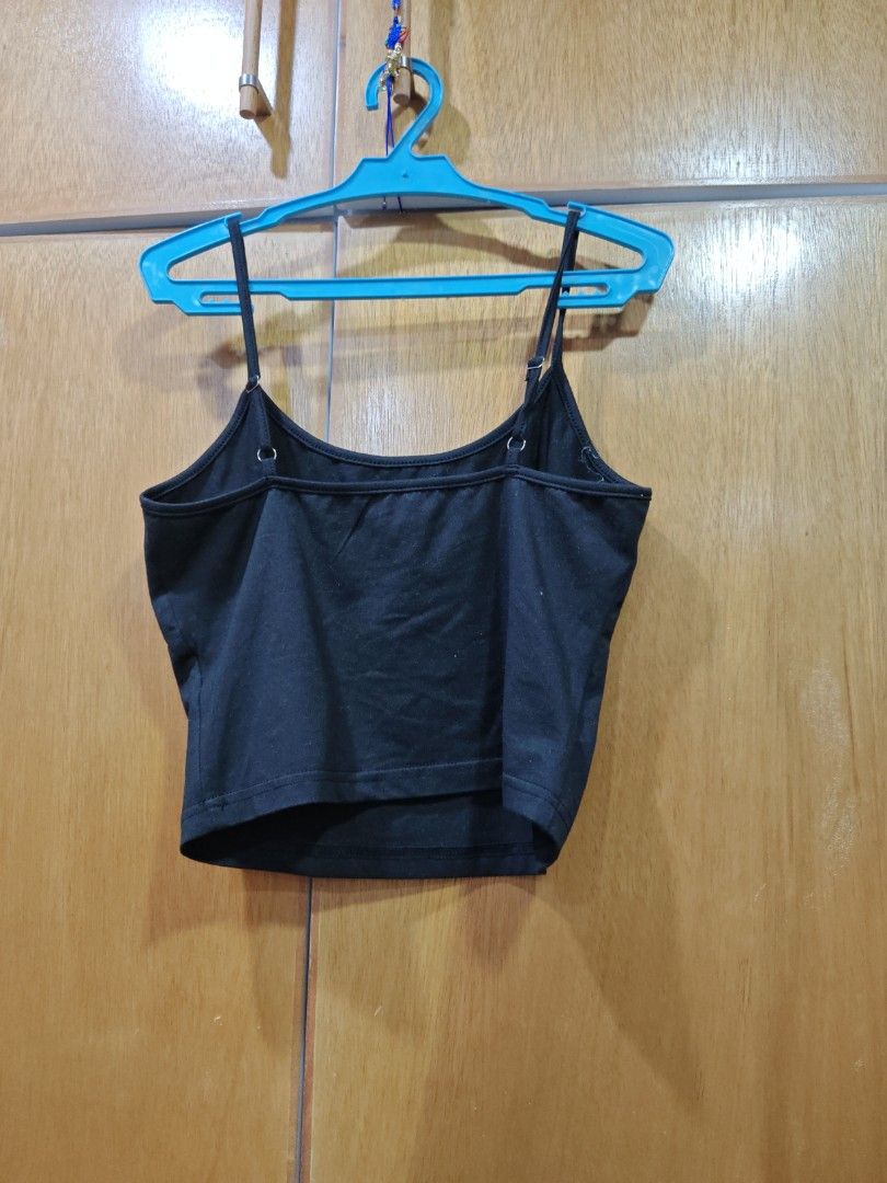 Black floral embroidered crop top cami spaghetti strap (Category: Sleeveless) located in Caloocan City. Submitted by grandfish.db3ec8 (Listing ID 1467744899, Image 3). Description: - Color: Black with light blue and pink floral embroidery - Style: Cami crop top with spaghetti straps and straight back - Fabric: Lightweight and comfortable - Fit: Perfect for pairing with high-waisted bottoms - Condition: Brand new / Excellent.