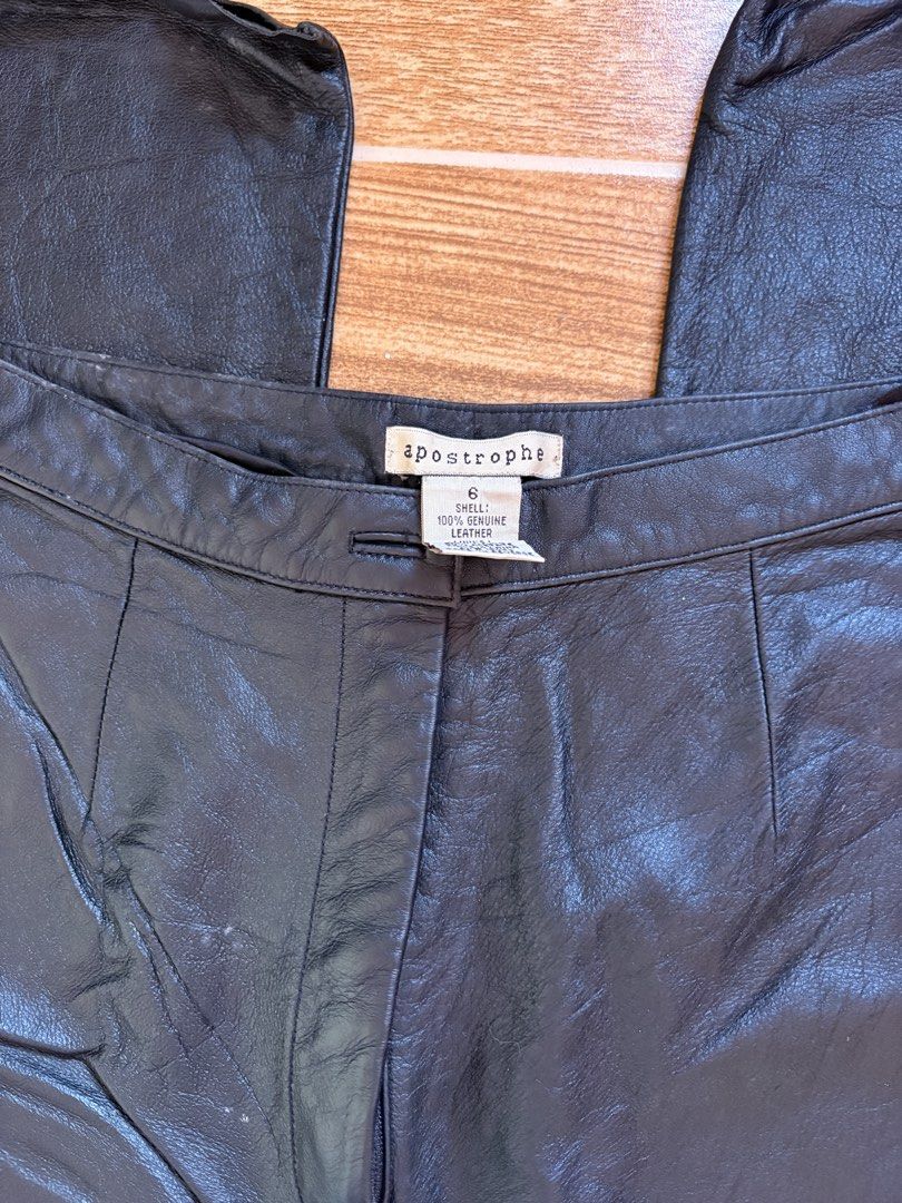 Black Genuine Leather Pants Size 6 (Category: Jeans) located in Manila. Submitted by _foryou (Listing ID 1467672614, Image 2). Description: - Brand: Apostrophe - Size: 6 - Material: 100% genuine leather with a shell finish - Fit: High-waisted with a classic straight leg cut - Details: Front pleats and secure button closure - Condition: Brand new with clean tags attached.