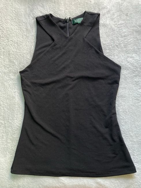 Black Halter Neck Tank Top (Category: Sleeveless) located in Rizal. Submitted by sheeraay (Listing ID 1467662950, Image 2). Description: - Brand: Lauren Ralph Lauren - Color: Classic Black - Style: Sleeveless top with high halter neckline and front crossover straps - Closure: Back zipper at the collar - Material: Soft and stretchy jersey - Fit: Fitted cut.