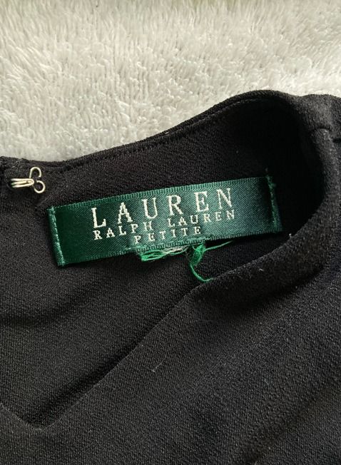 Black Halter Neck Tank Top (Category: Sleeveless) located in Rizal. Submitted by sheeraay (Listing ID 1467662950, Image 3). Description: - Brand: Lauren Ralph Lauren - Color: Classic Black - Style: Sleeveless top with high halter neckline and front crossover straps - Closure: Back zipper at the collar - Material: Soft and stretchy jersey - Fit: Fitted cut.