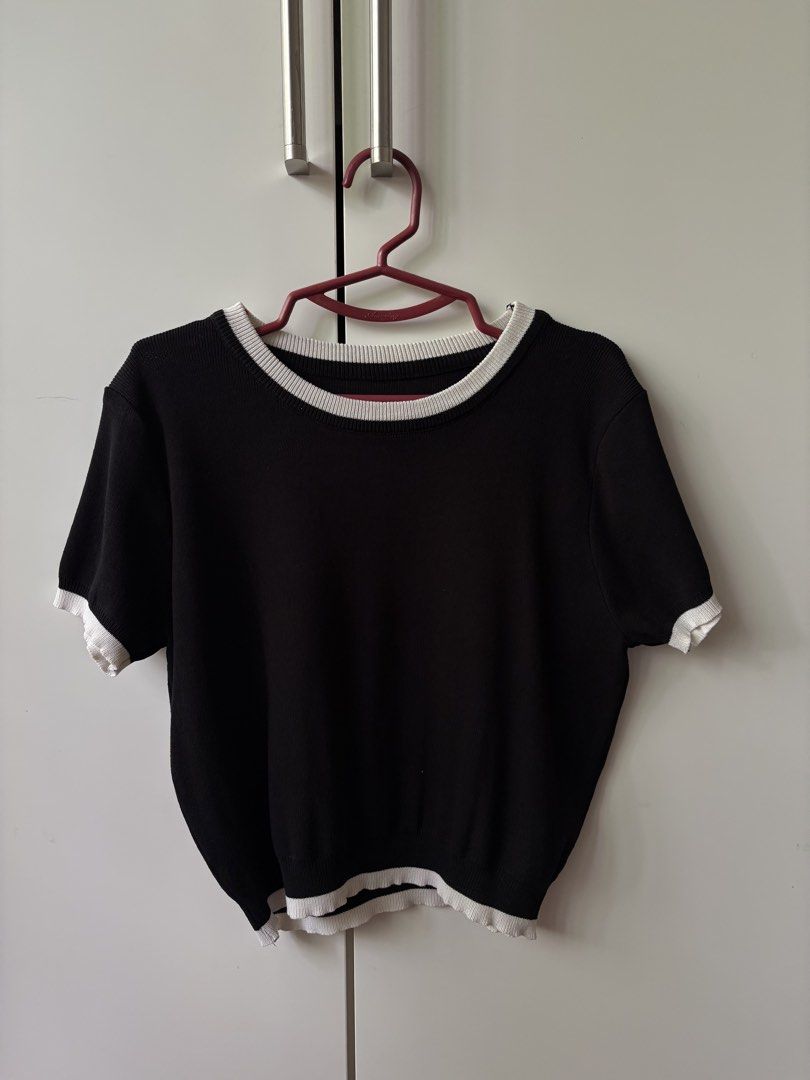 Black knitted top with white details (Category: Blouses) located in Makati City. Submitted by ssofiasellss (Listing ID 1467632201, Image 1). Description: Got this from Seoul No flaws Fits up to L.