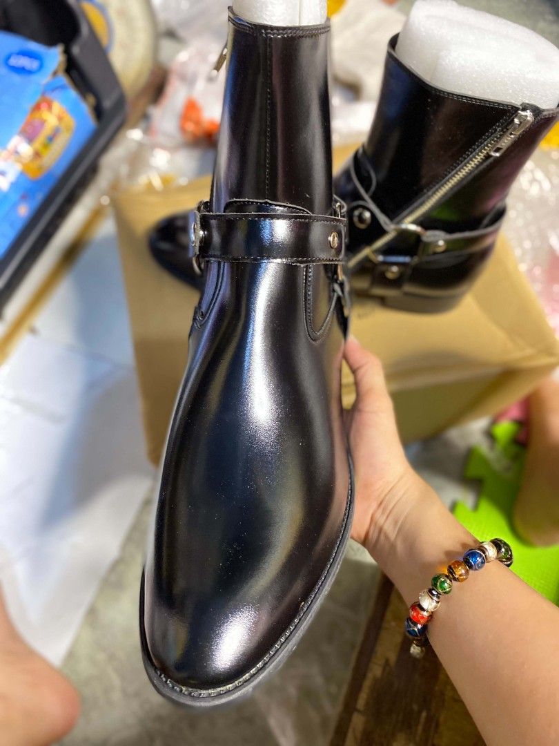 Black Leather Harness Boots with Side Zippers (Category: Boots) located in Taguig. Submitted by jerafelsan87737 (Listing ID 1467800834, Image 3). Description: - Color: Black - Material: Genuine leather - Style: Pointed toe, stacked heel, harness strap with metal ring and silver studs - Closure: Convenient side zipper - Extra Feature: Foam inserts included to maintain shaft shape - Freebie: 1 jar of Lemans leather cream included.