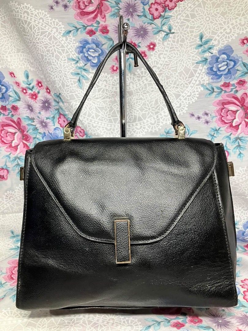 Black Leather Structured Handbag Made in Italy (Category: Luxury Bags & Wallets) located in Manila. Submitted by boldfire_315559 (Listing ID 1467662455, Image 1). Description: - Style: Black textured leather handbag with classic top handle - Hardware: Elegant gold-tone accents - - Closure: Front flap with vertical strap lock - Interior: Cream lining with a convenient zippered pocket - Authenticity: Made in Italy stamp with serial number N 400341 